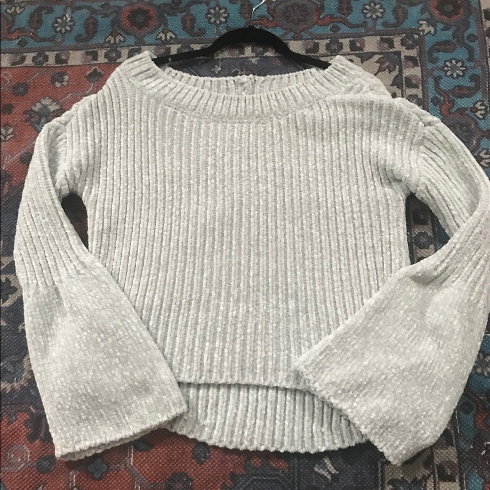 Velvet knit sweater with bell sleeves.
